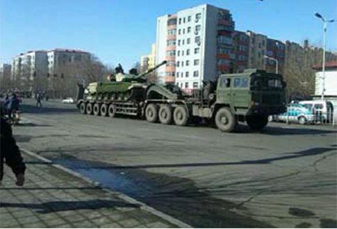Chinese Internet photo of a truck carrying a tank en route to an area near North Korea