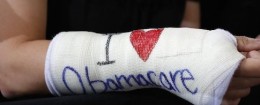 Cathey Park of Cambridge, Massachusetts wears a cast for her broken wrist with ''I Love Obamacare''