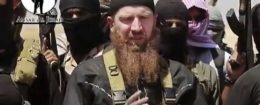 Image from undated video posted during the weekend of June 28, 2014 on a social media account showing Omar al-Shishani standing next to ISIS fighters. AP / militant social media account