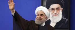 President Hassan Rouhani in front of a portrait of Iran's Supreme Leader Ayatollah Ali Khamenei