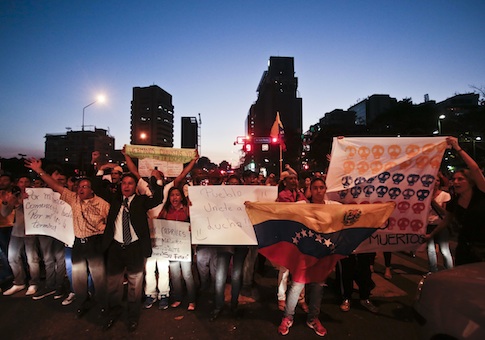 Anti-government demonstrators shout slogans against Venezuela's President Nicolas Maduro
