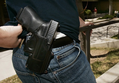 Student displays his Glock 9mm semi-automatic handgun on the University of Utah campus