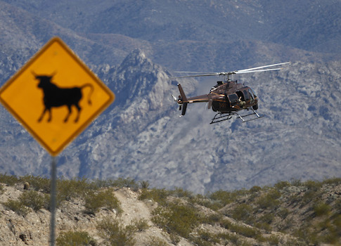 A helicopter takes off from a staging area of Bureau of Land Management outside the Bundy ranch / AP