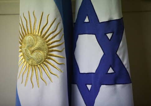 An Argentine and Israeli flag stand side by side