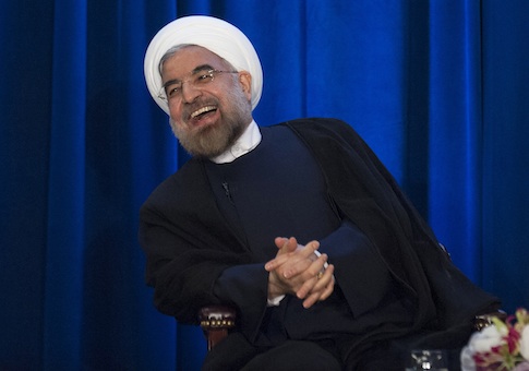 Iran's President Hassan Rohani laughs as he speaks during an event hosted by the Council on Foreign Relations and the Asia Society in New York