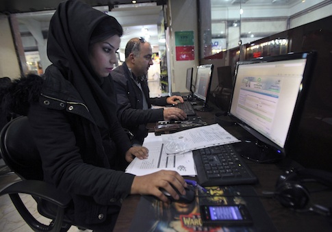 Iranians surf the web in an Internet cafe at a shopping center in central Tehran, Iran