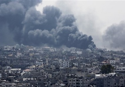 Smoke rises after an Israeli missile hit Shijaiyah neighborhood in Gaza City