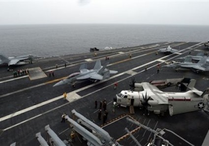 U.S. F18 Hornet fighter attack aircraft prepare to take off from the deck of the U.S. nuclear-powered aircraft carrier, USS George Washington during a military exercise off South Korea's West Sea