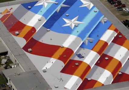 An American flag painted by New York artist Scott LoBaido on top of Lamons Gasket Company