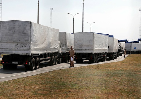 Trucks of a Russian convoy carrying humanitarian aid for Ukraine drive onto the territory of a Russia-Ukraine border crossing point "Donetsk" in Russia's Rostov Region