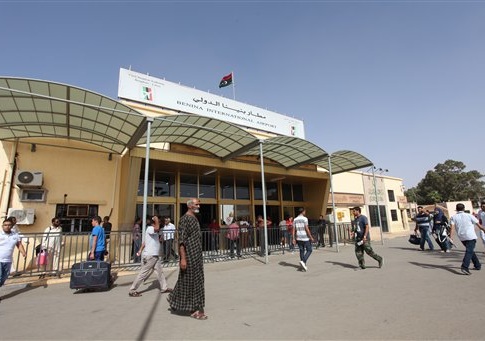 Libyans walk toward the departure hall in Benghazi airport, in Libya, Friday, Sept. 14, 2012