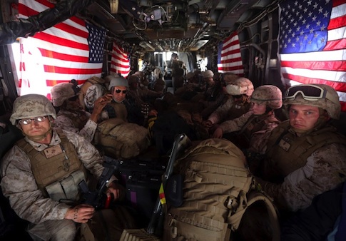 U.S. Marines are seen on board a helicopter at Kandahar air base upon the end of operations for the Marines and British combat troops in Helmand