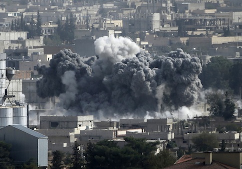 Smoke rises from the Syrian town of Kobani, seen from near the Mursitpinar border crossing