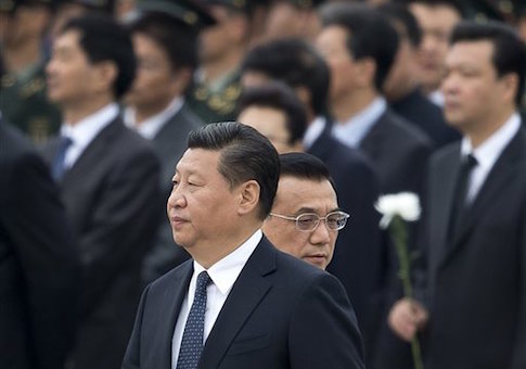 Chinese Premier Li Keqiang, right, walks past Chinese President Xi Jinping