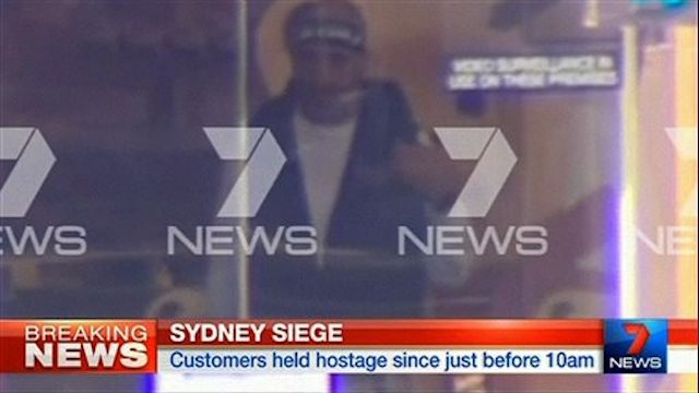 Sydney terrorist filmed through cafe window / AP Images