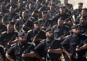 Members of Palestinian Hamas security forces march during their graduation ceremony at the fisherman's port in Gaza City