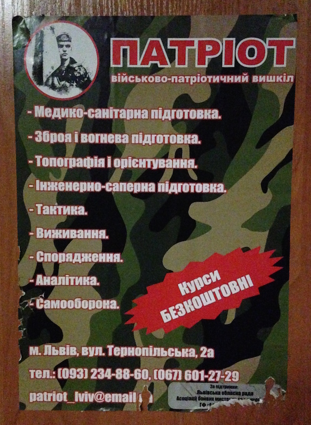 A flyer, posted on a college campus in Lviv, advertises free military training courses for volunteers.