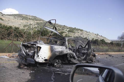 A burnt vehicle is seen near the village of Ghajar on Israel's border with Lebanon January 28, 2015