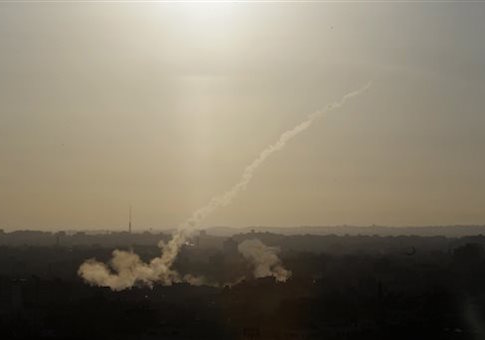 In this Aug. 9, 2014 file photo, a rocket is fired from Gaza City towards Israel