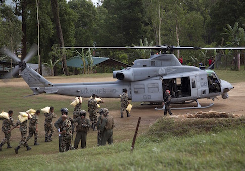 Nepalese service members load relief supplies into a U.S. Marine Corps UH-1Y Venom from Joint Task Force 505 at Sindhuli, Nepal in this May 11