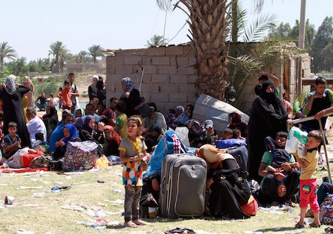 Displaced Sunni people fleeing the violence in the city of Ramadi arrive at the outskirts of Baghdad