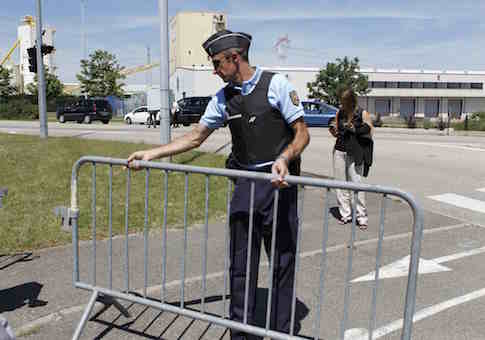 A French Gendarme blocks the access road to the Saint-Quentin-Fallavier industrial area