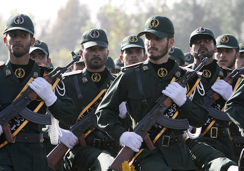 IRGC members march during a parade ceremony