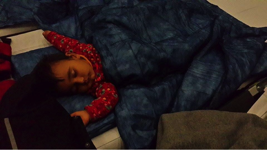 Roxanna sleeps on bedding in an Austrian camp.