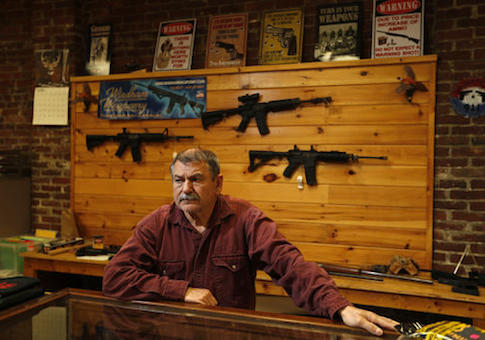 A man works in his gun shop in Maine