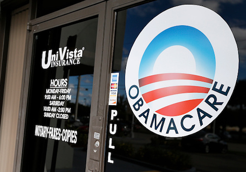 An Obamacare logo is shown on the door of the UniVista Insurance agency in Miami
