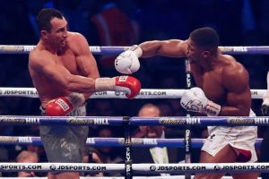 Britain's Anthony Joshua throws a punch at Ukraine's Wladimir Klitschko during the tenth round of their IBF, IBO and WBA, world Heavyweight title fight at Wembley Stadium in north west London