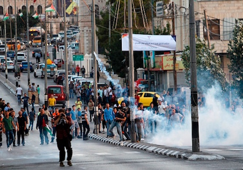 Palestinian protesters clash with Israeli security forces in the West Bank town of Bethlehem on July 19