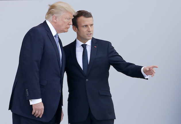 President Donald Trump and French President Emmanuel Macron attend the traditional Bastille day military parade on the Champs-Elysees on July 14 