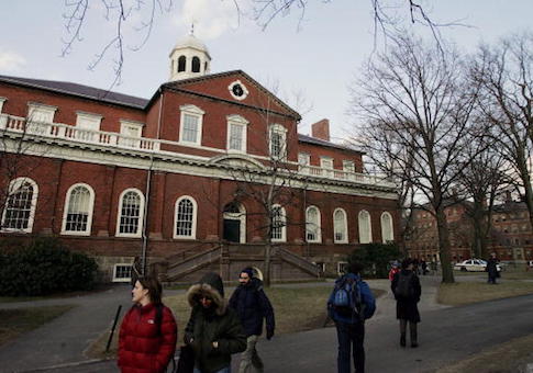 Harvard students walk through the campus