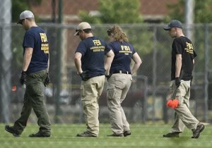 FBI and other law enforcement officials inspect a crime sceneFBI and other law enforcement officials inspect a crime scene