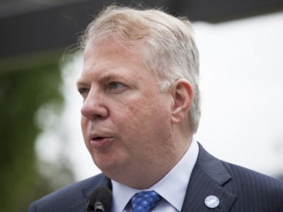 Seattle Mayor Ed Murray holds a press conference after signing a bill that raises the city's minimum wage to $15 an hour on June 3, 2014 in Seattle, Washington. / Getty Images