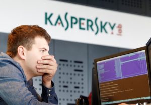 An employee works near screens in the virus lab at the headquarters of Russian cyber security company Kaspersky Labs