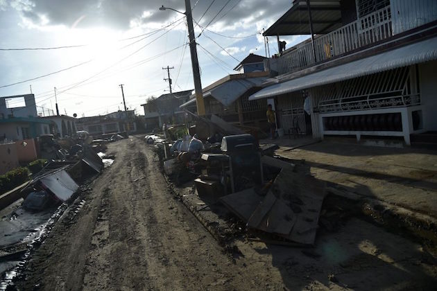 Furniture damaged by Hurricane Maria and debris are seen on a street in Toa Baja, Puerto Rico