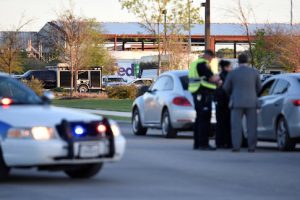 Law enforcement personnel attend the scene of a blast at a FedEx facility in Schertz