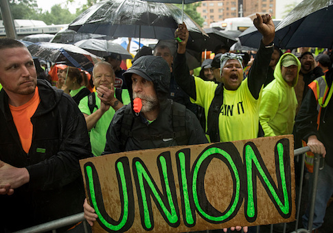 Construction workers and union members hold a rally in Columbus Circle in NYC