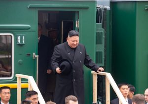 North Korean leader Kim Jong Un disembarks from a train during a welcoming ceremony at a railway station in the far eastern settlement of Khasan, Russia