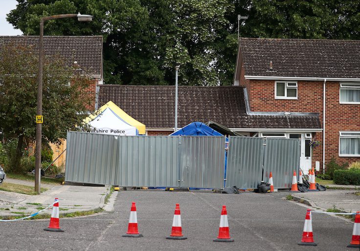 A barrier and a police tent stand outside Sergei Skripal's home in Salisbury, Britain