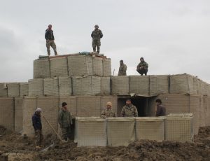 Afghan National Army (ANA) soldiers stand at a checkpost, where last night clashes took place between Taliban and Afghan forces in Kunduz, Afghanistan